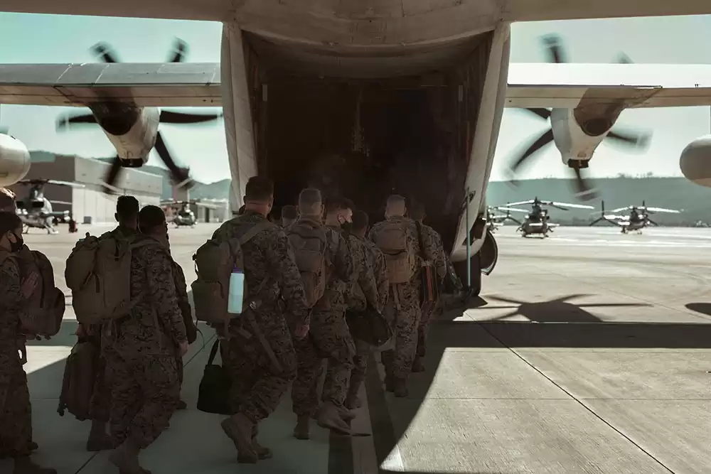 US soldiers boarding a military aircraft treated with MIL-C powder coating