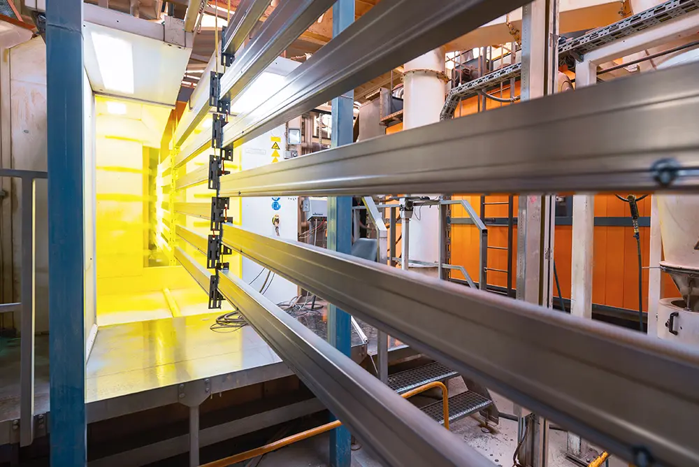 Industrial sized machine applying powder coating as a metal finish